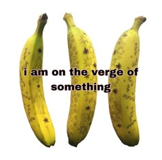 two yellow bananas with designs on them sitting next to each other in front of a white background