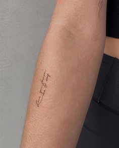 a woman's arm with a tattoo on it that says, i love you