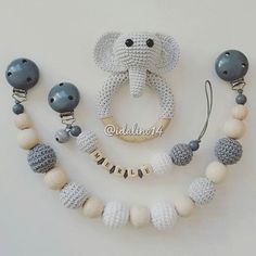 a crocheted elephant necklace and earring set with matching bead bracelets