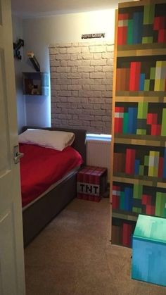 a bed room with a neatly made bed next to a brick wall