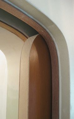 a close up of a door with wood trim on the bottom and side paneling