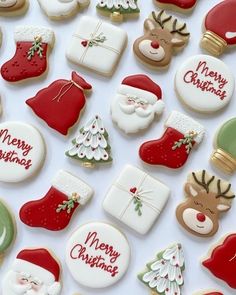 many decorated christmas cookies on a white surface