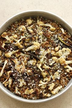 a bowl filled with lots of food on top of a table