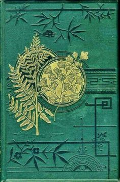 a green book with gold designs on it