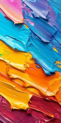 colorful paint is being used to create an abstract painting