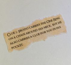 a piece of torn paper with the words clue 2 frodo carries the one ring on it