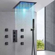 a shower head with blue leds and handshowing in the showerhead is shown