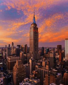 an aerial view of the empire building in new york city, ny at sunset or dawn