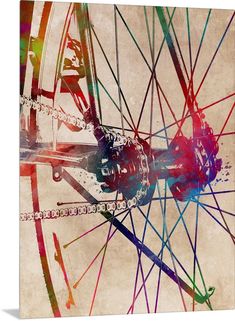 a bicycle wheel with colorful spokes on an old paper background