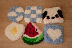 crocheted dish cloths with panda bear, watermelon and egg on them