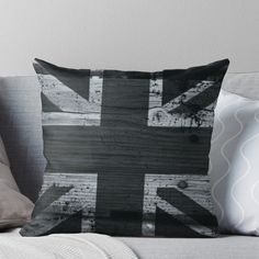 a black and white photo of the union jack flag on a couch thrower pillow