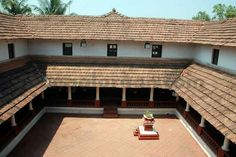 an old building with tiled roof and courtyard