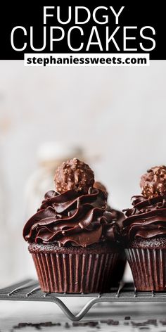 two chocolate cupcakes on a cooling rack with text overlay that reads fudgey cupcakes