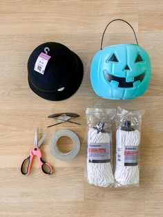 the supplies needed to make a jack - o'- lantern pumpkin costume are laid out on a wooden surface