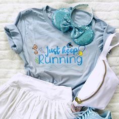 Just keep running.... Bring Dory, Marlin and Nemo along on your quest to complete the springtime surprise challenge. Complete all three races during this runDisney weekend and show off your accomplishments. Disney Event: Disney Characters: Finding Nemo Shirt Reads: Just Keep Running This t-shirt is everything you've dreamed of and more. It feels soft and lightweight, with the right amount of stretch. It's comfortable and flattering for all. • 100% combed and ring-spun cotton (Heather colors cont Finding Nemo Outfit, Marlin Nemo, Finding Nemo Shirt, Just Keep Running, Nemo And Dory, Disney Races, Run Disney Costumes, Disney Marathon, The Big Blue