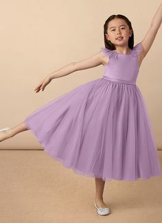 Let the flower girl be all dolled up in our tulle and satin dress Dolly. She has delicate ruffled tulle at the neckline that drapes over her shoulders and ends at a removable bow in the back. With this full skirt she can twirl to her heart's content. We’ve added most of our available colors to match any wedding party. Please note that the satin and tulle will differ slightly in shades of color due to difference in fabric, this is in no way a defect. Purple Flower Girl Dress, Wisteria Flower, Purple Beach, Beach Bridesmaid Dresses, Tulle Flower Girl, Flower Girl Dresses Tulle, Ankle Length Dress, Dress Flower, Flower Girl Dress