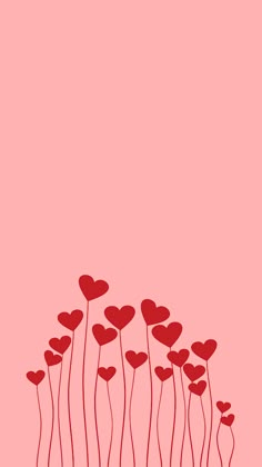 red hearts are floating in the air on a pink background