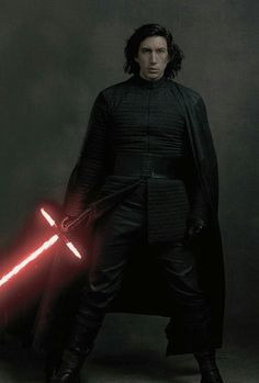 a man in black outfit holding a red light saber