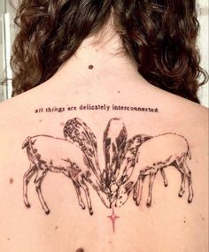 the back of a woman's neck with three sheep on it and an inscription that says, all things are politically interconnected