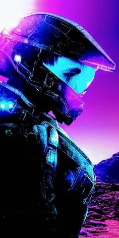 a man in a futuristic suit and helmet looking off into the distance with mountains in the background