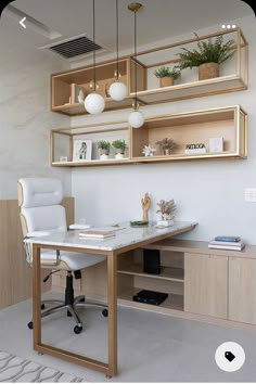 a home office with shelving and shelves on the wall, along with a white chair