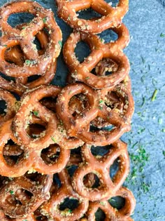 a pile of pretzels sitting on top of a blue surface