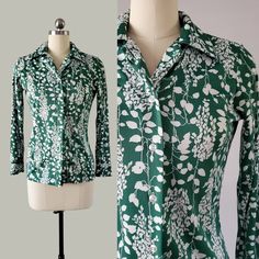 1970's shirt by Alfred Dunner in a lovely green with white floral and leaf silhouette print.   Features pointed collar, button closure and button cuffs.  The fabric is a soft polyester.  A super groovy addition to your wearable vintage collection.     Excellent vintage condition: no tears, holes, stains, fading or repairs.   Hand washed, hung dry and steamed by me, ready to wear.  Approximately a size small, pictured on a size 4 mannequin and there is some wige room. There is some stretch to the 70s Blouse, Leaf Silhouette, Alfred Dunner, Floral Shirt, Womens Clothing Tops, Vintage Collection, Vintage Ladies, Blouses For Women, Ready To Wear