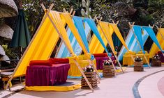 colorful tents set up in the middle of a walkway