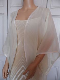 This is a beautiful hand made chiffon kimono ideal as a cover-up for weddings or special occasions. It has a satin edging It can be made in any size from 8 to 24 (UK sizes). It is made in the UK. It is normally sent out to you within 5 days, but I am very happy to make your order a priority if you need it urgently. Just let me know the date needed by. Postage is free in the UK! International postage is £9. I am happy to exchange items or refund your payment if you are less than happy with Organza Kimono, Chiffon Kimono Jacket, Chiffon Bolero, Crochet Bolero Pattern, Bridal Kimono, Chiffon Jacket, Kimono Outfit, Elegant Outfit Classy, Formal Dresses With Sleeves