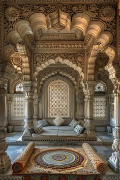 an intricately decorated room in the middle of a building with columns and arches on either side