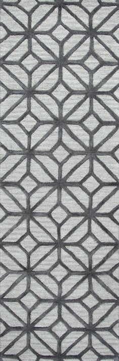 a gray and white rug with an abstract design