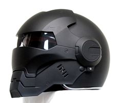 the helmet is black and has a visor on it's face for protection