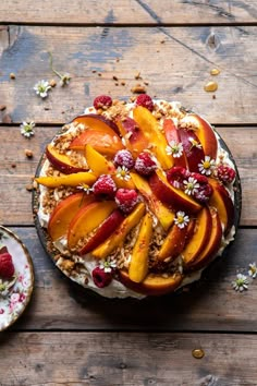 a cake topped with sliced peaches and granola