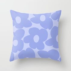 a blue and white pillow with flowers on it