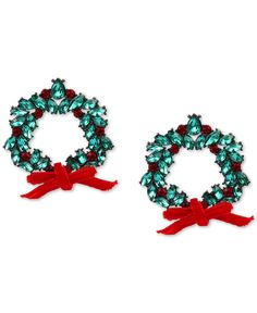 two christmas wreaths with red bows and green crystal beads on white background, side by side