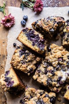 blueberry crumb bars cut into squares on a cutting board