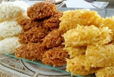 fried food items displayed on glass plate with doily