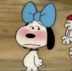 a cartoon dog with a blue bow on it's head and another dog wearing a red hat