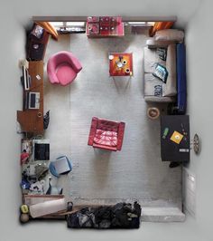 an overhead view of a living room with furniture and accessories on the floor, including a couch