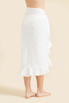 Made in a lightweight, textured cotton fabric, the Siena Sarong features a ruffled hem and a wrap tie. Whether you're headed to the beach or poolside, this sarong is the perfect match for your favorite swimsuit. Chic White Sarong For Summer, Fitted Summer Wrap Skirt For Vacation, Chic Summer Cotton Wrap Skirt, White Cotton Wrap Skirt For Summer, Chic Cotton Wrap Skirt For Summer, Fitted Wrap Skirt For Summer Vacation, White Wrap Sarong For Spring, Spring Beach Wrap Skirt With Tie Waist, Spring White Wrap Sarong