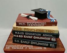 a stack of books with a graduation cap sitting on top of each book and the words ed's ph d, pychometricric