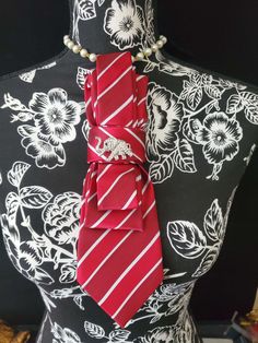 This Red and Whit Stripe Necktie Necklace is made with woven silk, and features a  Rhinestone Elephant Brooch strung on your choice of an adjustable Rosary Chain Ribbon Tie Pearl Necklace or an adjustable Elastic Band. The soft, comfortable fabric sits perfectly on any size chest, while the adjustable necklace feature allows you to customize the fit to your liking. Measuring at a versatile length, this necktie necklace is designed to be a one-size-fits-all. View all Women Tie's: https://www.etsy Dandy Jewelry, Womens Neck Tie Scarf, Classic Jewelry With Ties For Parties, Elegant Red Suit And Tie Accessories For Gift, Elegant Adjustable Neckwear As Gift, Elegant Adjustable Neckwear As A Gift, Elegant Adjustable Neckwear For Gifts, Elegant Adjustable Ties For Gift, Elegant Silver Tie As A Gift