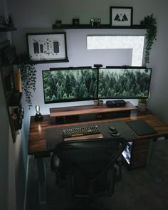 a computer desk with two monitors on it and a keyboard in front of the monitor