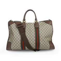 Gucci duffle bag in brown GG supreme monogram printed coated canvas with brown leather trim, red and green canvas racing stripes, rolled top handles with gold hardware, and an adjustable shoulder strap. Features a top-zip opening revealing a beige canvas inner lining and an inner zip pocket. Brand = Gucci Condition = 10/10, New with tags. Material = Coated canvas, leather Hardware = Gold Dimensions = 21" x 13" x 8" Top Handle = 6" Strap Drop = 23" (adjustable) SKU = 23699-5 Gucci Duffle Bag, Leather Hardware, Racing Stripes, Monogram Prints, Handbag Wallet, Wallet Accessories, Sneaker Collection, Canvas Leather, Leather Trim