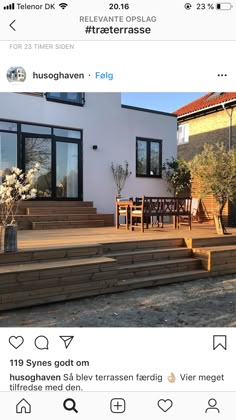 an image of a house with steps leading up to the front door and patio area