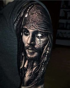 a man with a pirate tattoo on his arm