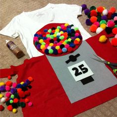 the table is covered with pom - poms, scissors and t - shirt