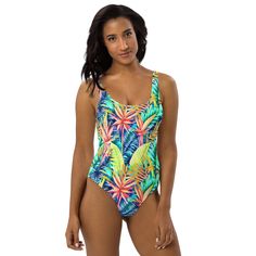 Inspired by the lush and vibrant tropical landscapes of Hawaii, our one piece swimsuit features a stunning print of tropical leaves that will transport you to the paradise islands. Your friends eyes will pop out at the sight of it! This one-piece swimsuit for all figures will bring out your best features. Enjoy the smooth fabric and the flattering design, and show it off by the sea or pool! • Made to order. • Tropical Leaves design is digital printed on fabric. • 82% Polyester, 18% Spandex • Fab Tropical Landscapes, Tropical Vacations, Leaves Design, Leaves Print, Tropical Foliage, Paradise Island, The Paradise, Tropical Landscaping, Print Swimsuit