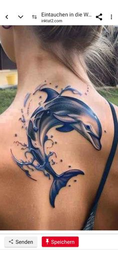 a woman with a dolphin tattoo on her back