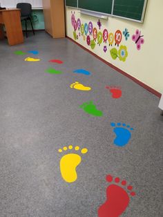 colorful footprints on the floor in a classroom